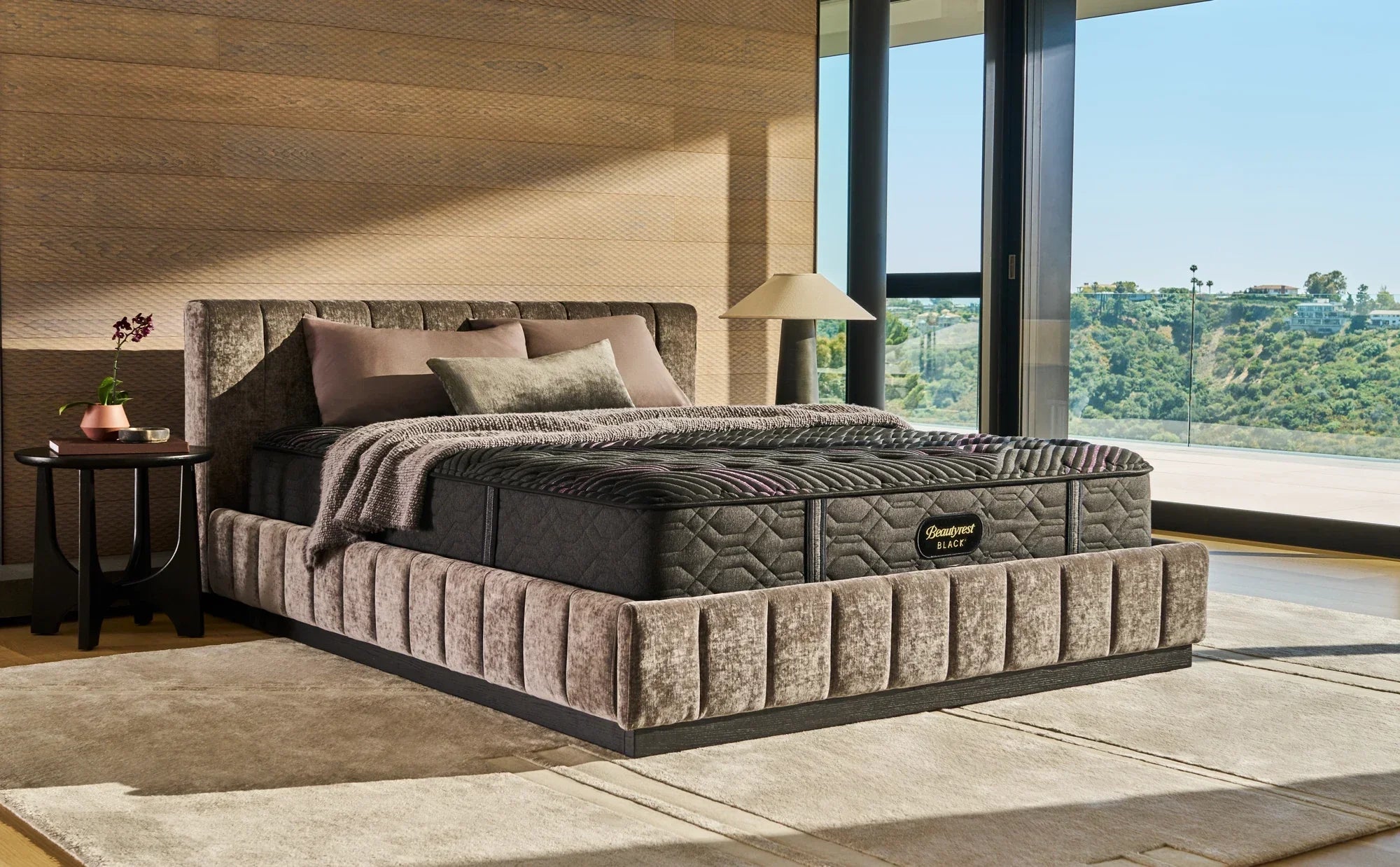 Beautyrest King mattress sitting in the a beige bedframe