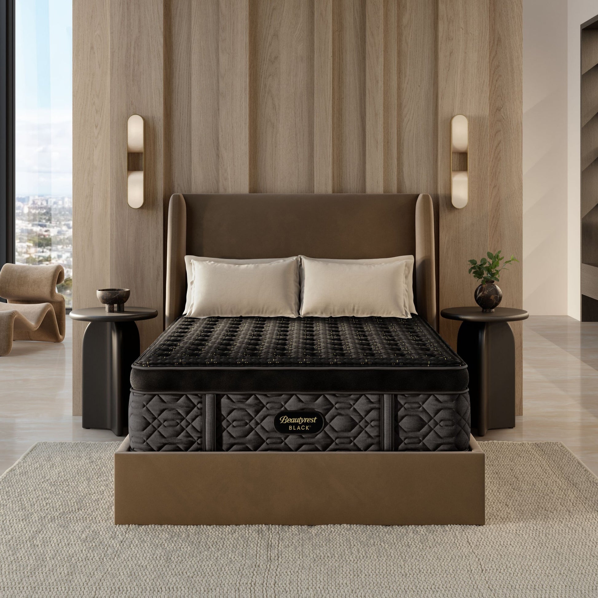 The Beautyrest Black firm summit pillow top mattress in a bedroom on a brown frame || series: Series Four || feel: firm summit pillow top