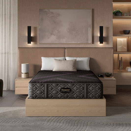 BeautyRest Firm Hybrid mattress sitting in a beige bed frame || series: Series Two || feel: Firm