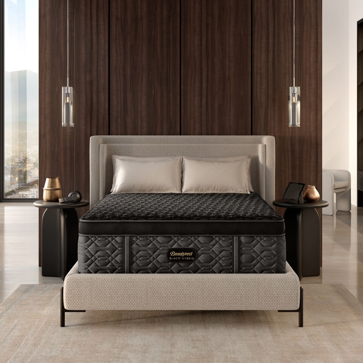 A man and woman laying on a BeautyRest Plush Apex Top Hybrid mattress sitting on an adjustable base || series: Series Four || feel: Plush Apex Top