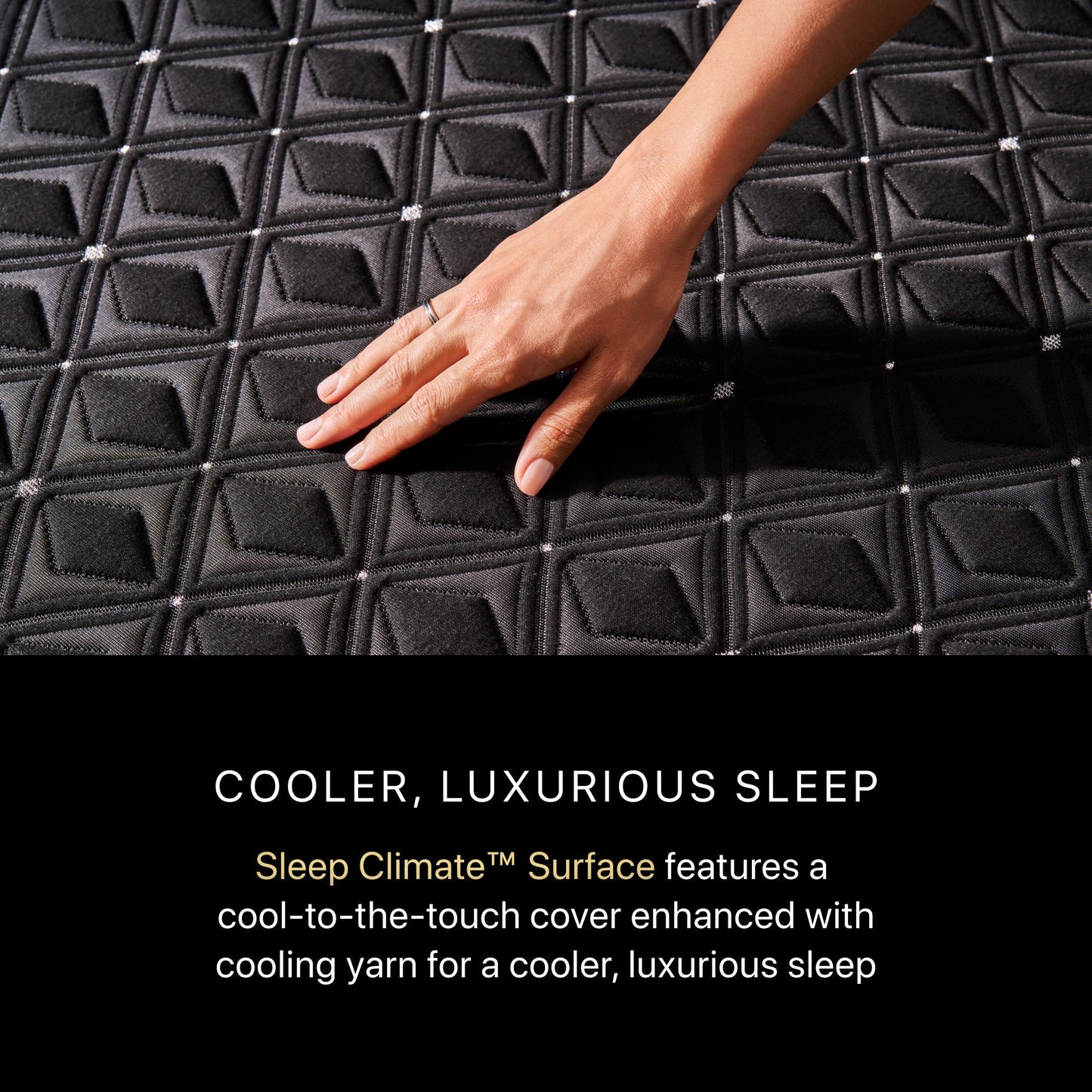 A hand rubbing on a BeautyRest Firm Hybrid mattress || series: Series Three || feel: Firm
