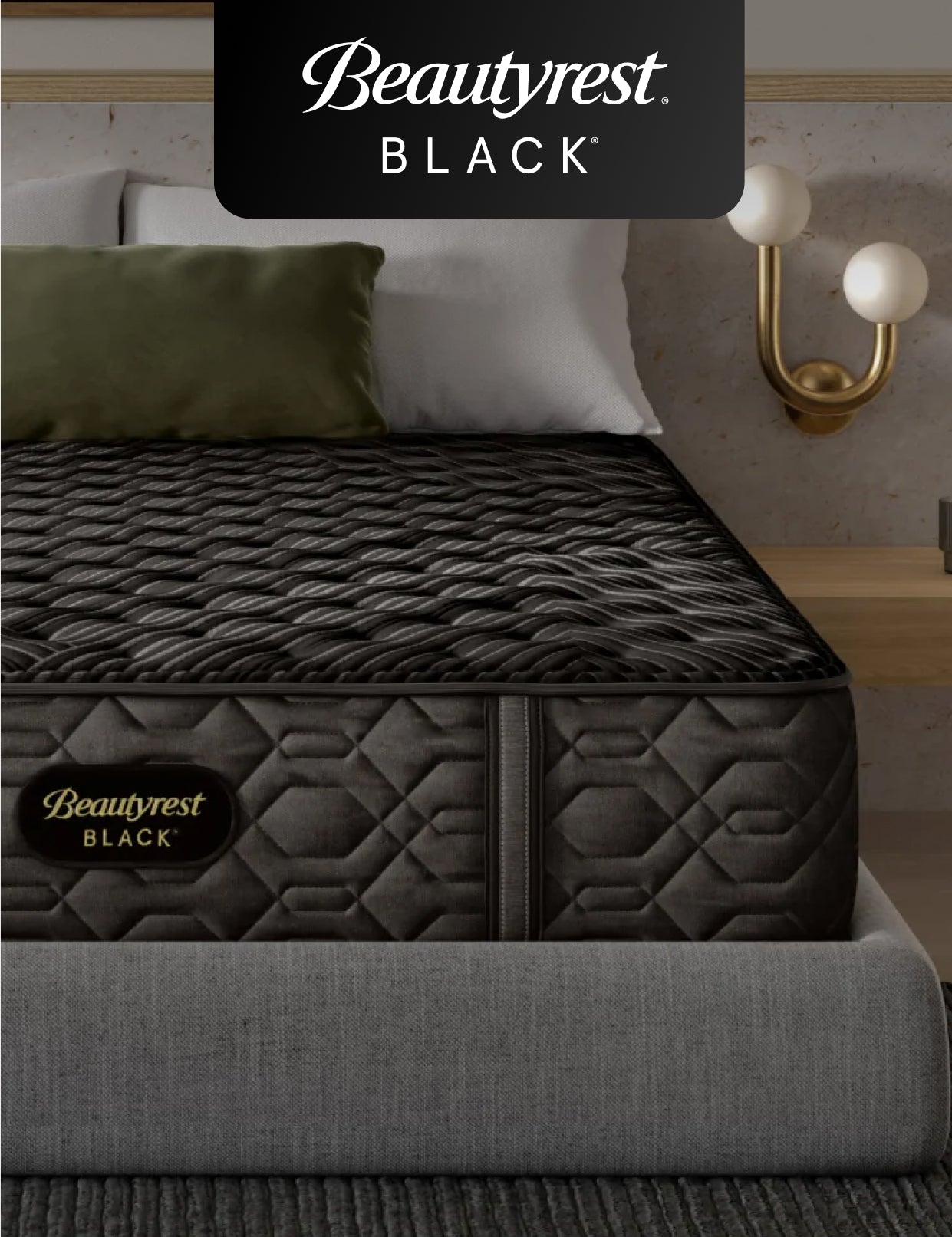 Beautyrest Black mattress sitting in a grey bedframe with 2 pillows on top of it.