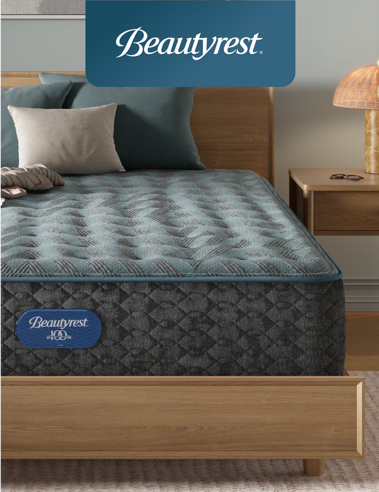 Beautyrest mattress sitting in a brown bedframe with 3 pillows on top of it.