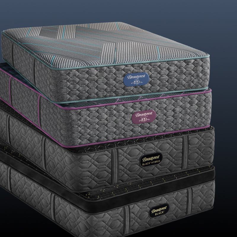 Stack of 4:  Beautyrest mattress, World Class, Black Hybrid and Black mattress stacked on top of each other.