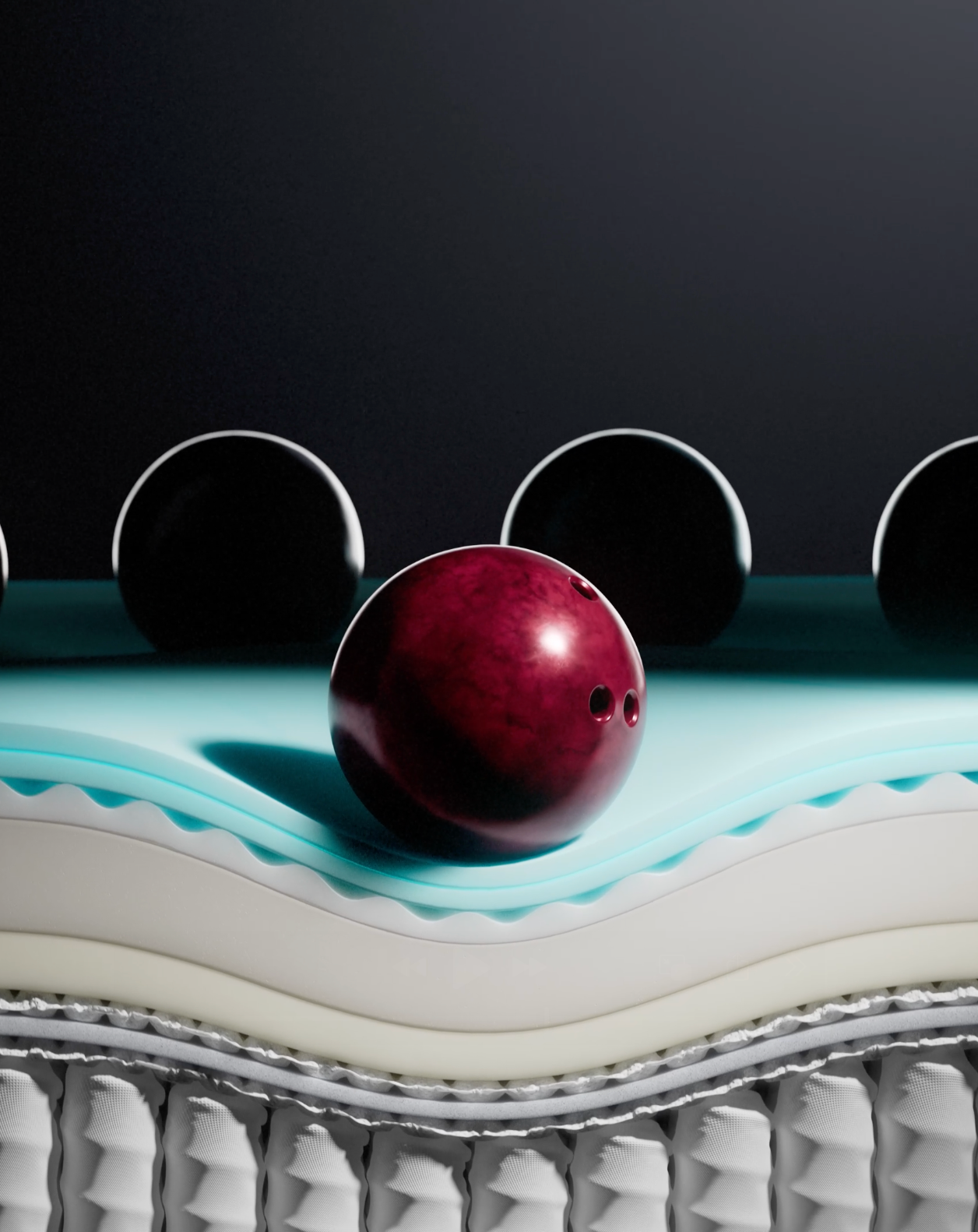 A close-up of a mattress with a red bowling ball resting on the surface, demonstrating motion isolation technology to minimize movement transfer across the bed.