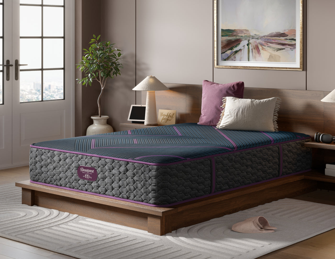 Beautyrest World Class Quilted Hybrid Level 3 mattress with 2 pillows on top of it sitting on a brown bed frame