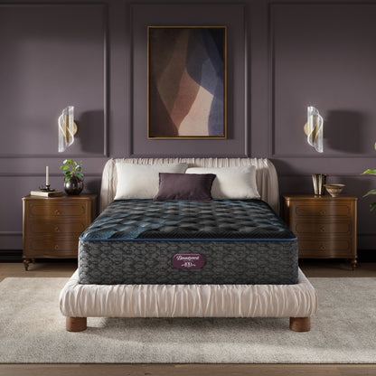 Beautyrest World Class mattress sitting in a brown bed frame with 3 pillows on top of it