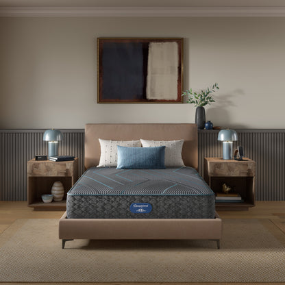 Beautyrest Hybrid Mattress mattress sitting in a beige bed frame with 3 pillows on top of it