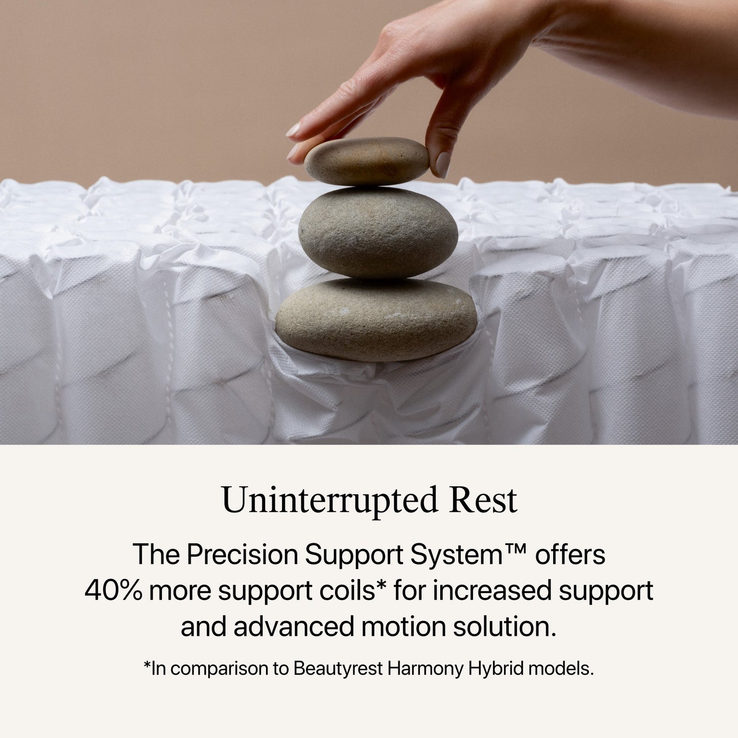 A hand stacking rocks, showing the firmness of the Beautyrest Harmony Lux Hybrid mattress || series: Premier Ocean View Island