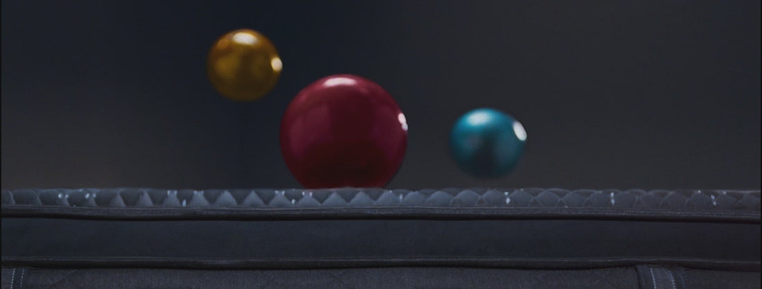 3 bowling balls landing on a Beautyrest mattress depicting motion separation, plus a woman laying on a mattress depicting individualized support.