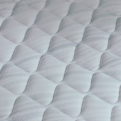 A hand pressing on the material of a Beautyrest Harmony mattress || series: Premier Beachfront Bay || feel: firm